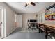 Bright office area with a fan, two large monitors, and workbench with an organized peg board at 541 N Lesueur St, Mesa, AZ 85203