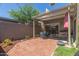 Private patio featuring brick pavers, covered pergola, and glass sliding doors for indoor/outdoor living at 541 N Lesueur St, Mesa, AZ 85203