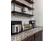 Convenient counter space with appliances and shelving for pet food storage at 5519 N 187Th Ln, Litchfield Park, AZ 85340