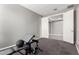 Exercise room featuring a carpeted floor, a weightlifting set, and bright light at 5519 N 187Th Ln, Litchfield Park, AZ 85340