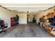 View of a garage with ample storage space and a red toolbox at 5519 N 187Th Ln, Litchfield Park, AZ 85340