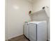 Laundry room featuring a side-by-side washer and dryer at 5519 N 187Th Ln, Litchfield Park, AZ 85340