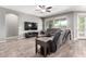 Comfortable living room with a large TV, modern furniture, and abundant natural light at 5519 N 187Th Ln, Litchfield Park, AZ 85340