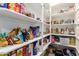 Walk-in pantry with plentiful storage for groceries and household items at 5519 N 187Th Ln, Litchfield Park, AZ 85340