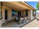 Back patio featuring a hot tub, covered area, and seating at 5519 N 187Th Ln, Litchfield Park, AZ 85340
