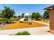 Community playground with slide, climbing structure and rubber mulch at 5519 N 187Th Ln, Litchfield Park, AZ 85340