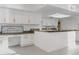 Bright kitchen with white cabinetry, granite countertops, and modern fixtures at 5742 W Shannon St, Chandler, AZ 85226
