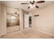 Bedroom featuring large mirrored closet, neutral paint, and ceiling fan at 5840 E Holmes Ave, Mesa, AZ 85206