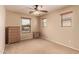 Cozy bedroom featuring a neutral color palette, natural light, and carpeting at 5840 E Holmes Ave, Mesa, AZ 85206