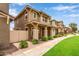 Street view of attractive two-story homes, each with welcoming front porches, desert landscaping, and well-kept sidewalks at 5840 E Holmes Ave, Mesa, AZ 85206