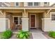 Inviting front porch with seating, desert landscaping, and attractive front door creating curb appeal for this lovely home at 5840 E Holmes Ave, Mesa, AZ 85206