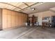 Spacious garage with built-in storage cabinets along one wall, offering ample space for parking and organization at 5840 E Holmes Ave, Mesa, AZ 85206