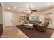 Open-concept living room featuring neutral tones, plush seating, and ample natural light, creating a comfortable and inviting space at 5840 E Holmes Ave, Mesa, AZ 85206