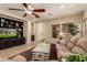 Inviting living room with a built-in entertainment center, plush seating, and natural light, creating a cozy and stylish atmosphere at 5840 E Holmes Ave, Mesa, AZ 85206