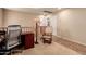 Open loft area with desk, chair, reading nook, and plenty of natural light at 5840 E Holmes Ave, Mesa, AZ 85206