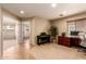 Bright office space featuring neutral carpet, desk, and a view of the living space at 5840 E Holmes Ave, Mesa, AZ 85206