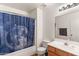 Bathroom featuring a tub with shower, moon-themed curtain, toilet, vanity, mirror, and towel bar at 684 E Redondo Dr, Gilbert, AZ 85296
