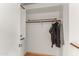 Well-lit closet features ample storage space and rod for hanging clothes and other garments at 684 E Redondo Dr, Gilbert, AZ 85296