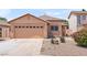 Charming single-story home with a well-manicured lawn and a two-car garage in a friendly neighborhood at 684 E Redondo Dr, Gilbert, AZ 85296