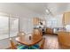Eat-in kitchen featuring wood cabinets, tile flooring, stainless steel appliances and natural light at 684 E Redondo Dr, Gilbert, AZ 85296