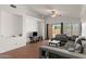 Cozy living room boasts tile floors, a ceiling fan, and abundant natural light from the backyard sliding glass door at 684 E Redondo Dr, Gilbert, AZ 85296
