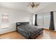 Spacious main bedroom features wood-look floors, a ceiling fan, and windows for natural light at 684 E Redondo Dr, Gilbert, AZ 85296