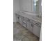 Bathroom features a dual sink vanity and modern fixtures at 7325 W Wilshire Dr, Phoenix, AZ 85035