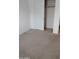 Bedroom showcasing carpet floors and a closet at 7325 W Wilshire Dr, Phoenix, AZ 85035
