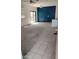 Bright living room with sliding glass doors, ceiling fan, and open layout at 7325 W Wilshire Dr, Phoenix, AZ 85035