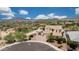 Aerial view of a home with a three-car garage and desert landscaping at 7432 W Bronco Trl, Peoria, AZ 85383