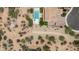 Expansive aerial view showcases a private backyard with a sparkling pool and desert landscape at 7432 W Bronco Trl, Peoria, AZ 85383
