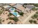 A high angle featuring a home with a backyard pool, lounging area and desert landscaping at 7432 W Bronco Trl, Peoria, AZ 85383