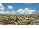 A high angle featuring neighborhood nestled in the desert with mountain views at 7432 W Bronco Trl, Peoria, AZ 85383