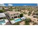 A high angle of the backyard, featuring a pool and desert landscaping at 7432 W Bronco Trl, Peoria, AZ 85383