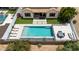 An elevated view showcasing the pool and deck with lounging chairs in the backyard at 7432 W Bronco Trl, Peoria, AZ 85383