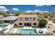 A high angle of the backyard, featuring a pool and lounging area at 7432 W Bronco Trl, Peoria, AZ 85383