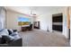 This bedroom offers a ceiling fan, carpet, and an office desk by the window at 7432 W Bronco Trl, Peoria, AZ 85383