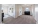 This bonus room offers carpet, large windows, and a piano at 7432 W Bronco Trl, Peoria, AZ 85383
