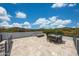 Spacious rooftop patio with outdoor dining and fire pit, perfect for entertaining guests at 7432 W Bronco Trl, Peoria, AZ 85383