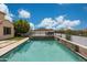 Beautiful pool area with flagstone border and mountain views at 7432 W Bronco Trl, Peoria, AZ 85383