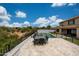 Rooftop patio view overlooking the sparkling pool and surrounding landscape at 7432 W Bronco Trl, Peoria, AZ 85383