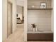 Hallway with a convenient bench, hooks for hanging coats, and decorative elements at 7445 E Vista Dr, Scottsdale, AZ 85250