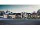 Stunning single-story home featuring a three-car garage, modern design, and manicured front yard at 7445 E Vista Dr, Scottsdale, AZ 85250