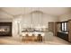 Modern kitchen featuring a spacious island, breakfast bar, and stylish pendant lighting at 7445 E Vista Dr, Scottsdale, AZ 85250