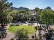 Stunning aerial view showcasing the lush landscaping, mature trees, and elegant architecture of this beautiful estate at 8022 N Ironwood Dr, Paradise Valley, AZ 85253