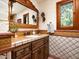 Charming bathroom with custom wood cabinetry, tile countertop, and decorative accents at 8022 N Ironwood Dr, Paradise Valley, AZ 85253