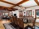 Spacious dining room boasting a large glass table, seating for ten, and a decorative chandelier at 8022 N Ironwood Dr, Paradise Valley, AZ 85253