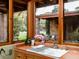 Kitchen sink featuring wood-trimmed windows and a view to a serene backyard at 8022 N Ironwood Dr, Paradise Valley, AZ 85253