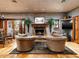 Cozy living room featuring a stone fireplace, hardwood floors, and comfortable seating at 8022 N Ironwood Dr, Paradise Valley, AZ 85253