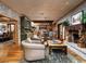 Open-concept living space with a fireplace, hardwood floors, and views into other rooms at 8022 N Ironwood Dr, Paradise Valley, AZ 85253